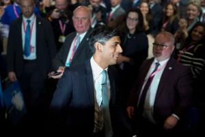 Prime Minister Rishi Sunak leaves following his speech during the final day of the Conservative Party Conference on Oct. 4 in Manchester, England. 