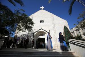 Palestinian Catholics gather for Mass at Holy Family Church in Gaza City on Dec. 19, 2021.