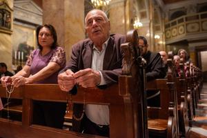 Local Christians pray the rosary during a prayer service hosted by the Franciscan friars of the Custody of the Holy Land on Saturday, Oct. 14, 2023, in St. Saviour's Church, Jerusalem.