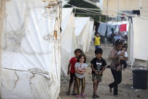 Tents for Palestinians seeking refuge are set up on the grounds of a United Nations Relief and Works Agency for Palestine Refugees (UNRWA) centre in Khan Yunis in the southern Gaza Strip on October 19, 2023, amid the ongoing battles between Israel and the Palestinian group Hamas. 