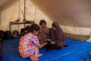 Palestinian children rest in a refugee tent along the Gaza Strip on Oct. 20 in Khan Yunis, Gaza. 