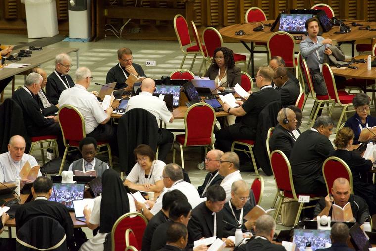 Synod participants listen in during table discussions at the Synod on Synodality at the Vatican October 2023.