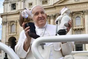 Pope Francis smiles at the general audience at St. Peter's Square on Oct. 25.