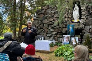 Patrick Norton tells his incredible story of meeting who he believes was Sister Annella Zervas at Our Lady of Lourdes Grotto in the St. Benedict Monastery cemetery in St. Joseph, Minnesota. Around 150 people gathered for an event where a letter was read from the local bishop about steps being taken to look into opening a cause for Sister Annella on Oct. 15.