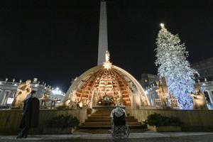 Pope Francis visits the Nativity scene in St. Peter's Square following vespers on New Year's Eve, Dec. 31, 2022.