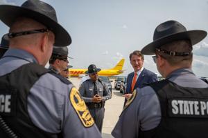 Virginia Gov. Glenn Youngkin with state police in 2023.