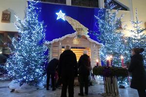 Polish Catholics visit a parish Nativity scene