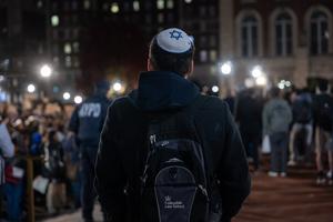 A Jewish student watches a protest in support of Palestine and for free speech on the Columbia University campus on Nov. 14, 2023, in New York City. 