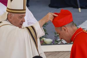 Newly elected Cardinal Víctor Manuel Fernández, Prefect of the Dicastery for the Doctrine of the Faith, right, receives his biretta from Pope Francis as he is elevated in St. Peter's Square at the Vatican, Saturday, Sept. 30, 2023. 