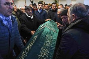Relatives and friends carry the coffin of Tuncer Cihan, who was killed on an attack to a Catholic church, during his funeral ceremony in Istanbul, Turkey, Monday, Jan. 29, 2024. The Islamic State group has claimed responsibility for an attack on a Roman Catholic church in Istanbul during a Sunday Mass that killed one person.