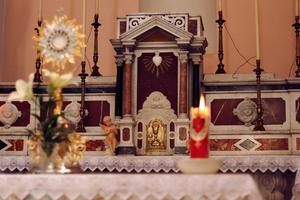 Adoration inside Sacred Heart of Jesus chapel in Chiaravalle, Calabria in Italy. 