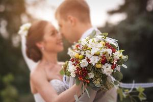 Couple embraces on wedding day. 