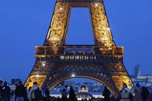 'Hashtag My Body My Choose' in big letters projected on the first floor of the Eiffel Tower when it is lighted up. The City of Paris organizes with the Fondation des Femmes a giant screen broadcast of the Congressional vote to enshrine IVG Voluntary Interruption of Pregnancy in the French Constitution. 