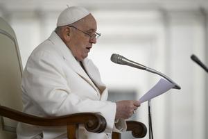 Pope Francis addresses pilgrims gathered in St. Peter’s Square for his Wednesday general audience on March 13.
