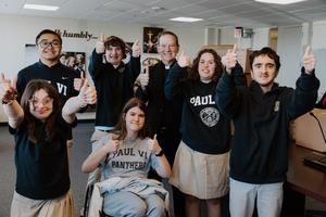 Options students from St. Paul VI Catholic High School visit the Arlington chancery and strike a pose with Bishop Michael Burbidge.
