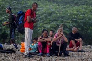 Migrants rest in Bajo Chiquito village, the first border control of the Darien Province in Panama, on September 22, 2023. The clandestine journey through the Darien Gap usually lasts five or six days, at the mercy of all kinds of bad weather. 