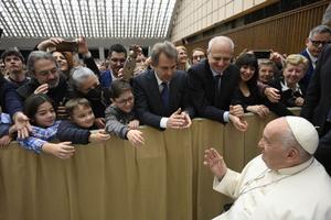 Pope Francis greets staff and families of RAI, Italy’s national public broadcasting company, March 23.