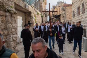 Students and teachers from Jerusalem Christian schools walk the Way of the Cross on the Via Dolorosa in Jerusalem on on Feb. 23. The yearly event was organized by the Custody of the Holy Land.