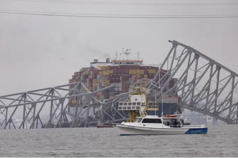 Workers continue to investigate March 27 and search for victims after a cargo ship collided with the Francis Scott Key Bridge, causing it to collapse the day before in Baltimore.