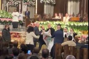 Protesters disrupt the Easter Vigil Mass at St. Patrick's Cathedral in New York City on March 30, 2024.