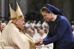 Pope Francis greets a woman religious at a Mass on the World Day of Consecrated Life, the feast of the Presentation of the Lord, on Feb. 2, 2024, in St. Peter's Basilica at the Vatican.