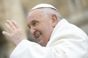 Pope Francis waves to pilgrims in St. Peter's Square gathered for his weekly general audience on April 3, 2024.