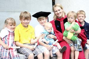 Catherine Pakaluk, shown at her doctoral graduation with some of her children, has been researching women who, like herself, have five or more children. 