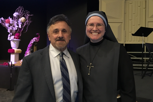 Frank DeAngelis, principal of Columbine High School in April 1999 when the horrific shooting happened poses with Jenica Thornby who also survived that day and is now Sister Mary Gianna, with the Disciples of the Lord Jesus Christ in Prayer Town, Texas.