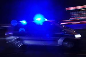 A police car with lights flashing.