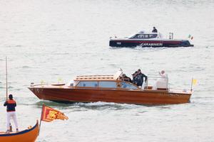 Pope Francis waves while traveling by boat in Venice, Italy, for a meeting with young people at the Basilica della Madonna della Salute on April 28. Earlier in the day he met with inmates at a women's prison.