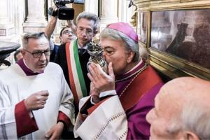 Naples Archbishop Domenico Battaglia kisses the reliquary containing the blood of St. Januarius on May 4.