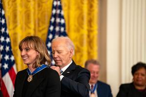 U.S. President Joe Biden presents the Presidential Medal of Freedom to Olympic swimmer Katie Ledecky during a ceremony in the East Room of the White House on May 3 in Washington. 