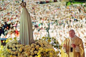 Pope John Paul II celebrates Mass May 12, 1991 in the Chapel of the Apparition in front of the statue of Fatima where about a million believers attended the Procession of Candles. 