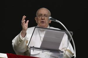Pope Francis speaks from the window of the Apostolic Palace on a rainy Sunday in Rome on Feb. 11, 2024.