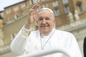 Pope Francis waves to pilgrims gathered in St. Peter’s Square for his Wednesday general audience on May 8, 2024.