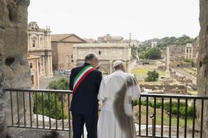 Pope Francis gazes over the ancient ruins of the Roman Forum with Rome Mayor Roberto Gualtieri during a visit to Rome’s historic Capitoline Hill on June 10, 2024.