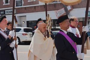 Archbishop Samuel Aquila leads the Eucharistic procession down Colfax Avenue in Denver on June 9, 2024.