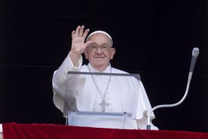 Pope Francis waves to pilgrims gathered in St. Peter’s Square for his Angelus address on Sunday, June 16, 2024.