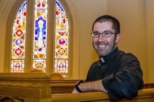 Father Patrick Reidy sits in the St. Thomas More Chapel inside Notre Dame Law School.