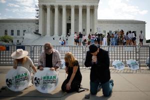 Pro-life activists pray in front of the U.S. Supreme Court in Washington, DC. 
