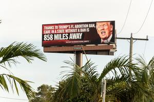 A billboard sponsored by The Democratic National Committee with the message “Trump’s Plan: Ban Abortion, Punish Women” is pictured on May 1, 2024 in Hollywood, Florida. 