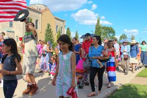 Families joined the procession as the Eucharist left the Shrine of St. Rose Philippine Duchesne, headed for St. Peter Parish.