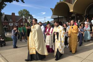 Father Mick Kopil, pastor of Our Lady of Sorrows in Valparaiso, Indiana, a parish of the Diocese of Gary, leads a procession. Behind him are Bishop Robert McClory of Gary and Father Andrew Summerson, pastor of St. Mary’s Byzantine Church in Whiting.