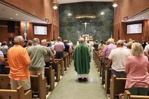 Parishioners attend a July 2024 Mass at St. Peter Church in Quincy, Illinois. This parish is one of many participating in the “Family School Agreement” meant to increase regular Mass attendance and activity among parishioners.