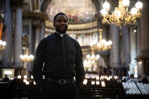 Former judoka and French priest Father Jason Nioka, in charge of training the Catholic chaplains who will accompany the athletes in the Olympic Village, poses in the Madeleine church in Paris, on July 16. 