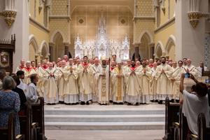 Bishop Jacques Fabre-Jeune poses alongside many of the priests of the Diocese of Charleston, South Carolina, at a recent ordination. The diocese has seen a recent surge in vocations
