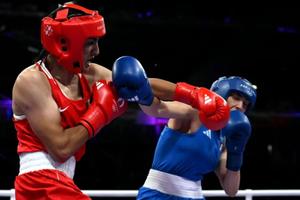 Algeria's Imane Khelif (in red) punches Italy’s Angela Carini in the women’s 66kg preliminaries round of 16 boxing match during the Paris 2024 Olympic Games at the North Paris Arena in Villepinte on Aug. 1. 