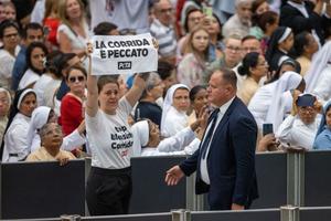 An activist from PETA (People for the Ethical Treatment of Animals) holds a sign that reads “la corrida e peccato” (“bullfighting is a sin”), temporarily interrupted Pope Francis’ catechesis during his Wednesday general audience on Aug. 7, 2024.