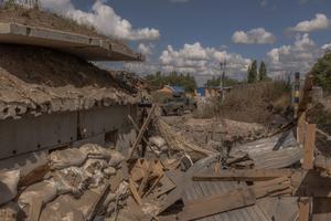 Ukrainian servicemen drive a Humvee military vehicle past a destroyed border crossing point with Russia, in the Sumy region, on August 14, 2024, amid the Russian invasion of Ukraine. Ukraine launched a surprise offensive into the Russian border region of Kursk on August 6, 2024, capturing over two dozen towns and villages.