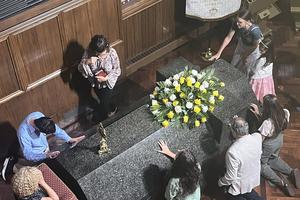 Pilgrims venerate the relic of Blessed Michael McGivney and pray at his tomb.
